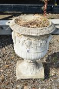A COMPOSITE GARDEN URN, with grape and vine detailing to out edges, approximate diameter 40cm x