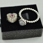 A PANDORA RING AND CHARM