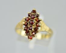 A 9CT MARQUISE SHAPED GARNET RING, ring size O, approximate weight 3.6 grams