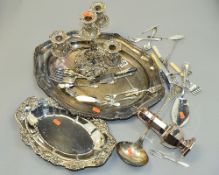 A QUANTITY OF SILVER PLATED WARE, to include a candelabra with scrolling acanthus leaf detail, a