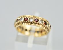 A 9CT STONE SET FULL ETERNITY RING, ring size J, approximate weight 3.4 grams