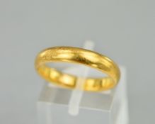 A 22CT BAND, ring size O, approximate weight 5.4 grams