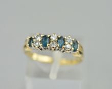 A 9CT RING SET WITH EMERALDS AND SPINELS, ring size K, approximate weight 2.2 grams