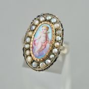 A VINTAGE WHITE METAL RING WITH A HAND PAINTED PORTRAIT OF A CHERUB, enclosed within a border of