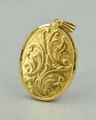A LATE 20TH CENTURY 9CT GOLD LOCKET, a large oval locket with scroll work decoration, measuring
