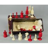 A VICTORIAN TURNED BONE CHESS SET, natural and red stained, maximum height 10cm, minimum height 3.