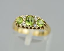 A 9CT PERIDOT AND DIAMOND RING, ring size M, approximate weight 2.6 grams