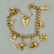 A LATE 20TH CENTURY 9CT CHARM BRACELET, double curb link together with eight assorted attached