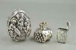 A SILVER VESTA CASE, a modern egg ornament cast with religious scenes and a metal ornament (3)