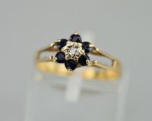 A 9CT SAPPHIRE AND DIAMOND CLUSTER RING, ring size M, approximate weight 1.5 grams