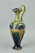 A ROYAL DOULTON STONEWARE EWER, on mottled green ground with applied floral decoration, impressed