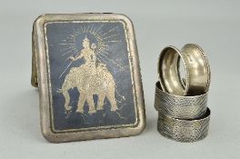 AN INDIAN SILVER CIGARETTE CASE, three silver napkin rings