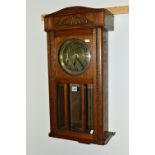 A MID 20TH CENTURY OAK WALL CLOCK