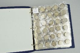 AN ALBUM OF BRITISH COINS, to include over 1100 grams of pre 1947 silver with some decent grades,