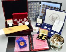A BOX OF COINS AND WOODEN COIN CASES, to include a cased set of silver I.O.M. Crowns, other silver
