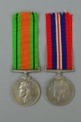 A WWII DEFENCE & WAR MEDAL, un-named as issued with box of issue and slips to LAC (Leading