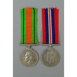 A WWII DEFENCE & WAR MEDAL, un-named as issued with box of issue and slips to LAC (Leading