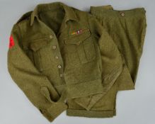 A BRITISH WWII ERA UNIFORM JACKET/TROUSERS, belonging to a soldier from the 'Royal Signals', the