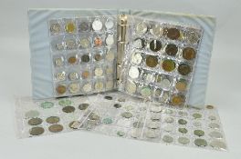 A SMALL COIN ALBUM OF WORLD COINS, to include some silver