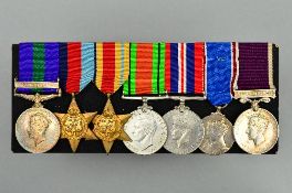A MOUNTED GROUP OF SEVEN CAMPAIGN/WWII SERVICE MEDALS, a follows, George VI General Service medal,