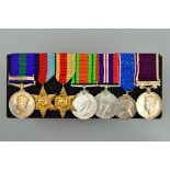 A MOUNTED GROUP OF SEVEN CAMPAIGN/WWII SERVICE MEDALS, a follows, George VI General Service medal,