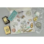 A BOX CONTAINING A NUMBER OF PIN BADGES, TIE PINS, COMMEMORATIVE COINS, all military related,