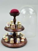 A SET OF FIFTEEN ROYAL CROWN DERBY THIMBLES WITH DOMED STAND