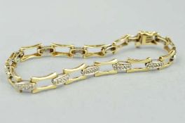 A 9CT DIAMOND BRACELET, with a fancy link chain with a box and clip clasp, foreign assay mark,