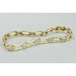 A 9CT DIAMOND BRACELET, with a fancy link chain with a box and clip clasp, foreign assay mark,