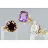 THREE 9CT LARGE SINGLE STONE RINGS, to include a rock crystal, emerald cut ring, rock crystal