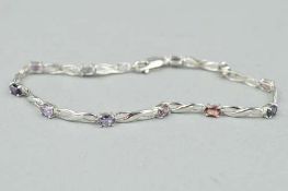 A 9CT MIXED GEM BRACELET, containing eleven gems of purple and pink shades, with lobster claw,