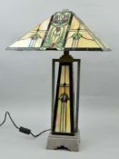 A LARGE TIFFANY STYLE TABLE LAMP, having a square canopy shaped shade, central illuminated column,
