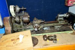 A VINTAGE METALWORKING LATHE (inscribed Dewhurst and Partners) with a 55cm bed and various