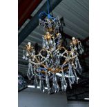 A 20TH CENTURY GILT METAL CHANDELIER, foliate design with glass droppers