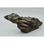 A BRONZED FIGURINE, nude in waves with birds in flight alongside her, approximate length 43cm x
