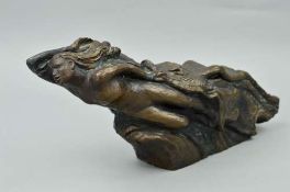 A BRONZED FIGURINE, nude in waves with birds in flight alongside her, approximate length 43cm x