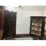 TWO GLAZED HANGING CORNER CUPBOARDS