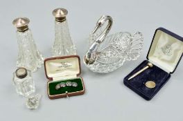 A PAIR OF EDWARDIAN CUT GLASS SCENT BOTTLES, with silver cover, one a.f under collar, London 1909,