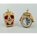 TWO EARLY 20TH CENTURY FOBS, the first with a compass to one side and bloodstone to the other,