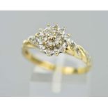 A 9CT GOLD DIAMOND DRESS RING, designed as a tiered single cut diamond cluster with diamond detail