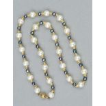 A CULTURED PEARL NECKLACE, with twenty five cultured pearls, interspaced by twenty four dyed