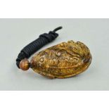 A CARVED BURMESE AMBER PENDANT, carved to depict a fish with cord chain, approximate length of