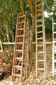TWO WOODEN EXTENDING LADDERS, and three sets of wooden steps (5)