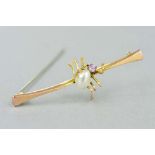 AN EARLY 20TH CENTURY GEM BUG BROOCH, designed as a spider with pearl body and purple gem head,