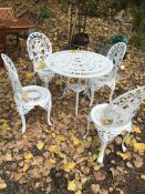A MODERN CAST ALUMINIUM ROUND GARDEN TABLE, with four chairs (5)
