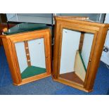 TWO GLASS FRONTED CORNER WALL MOUNTED WOODEN DISPLAY CABINETS, one is approximately 65cm wide x 38cm