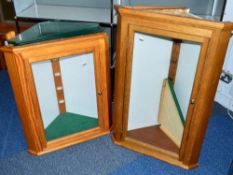 TWO GLASS FRONTED CORNER WALL MOUNTED WOODEN DISPLAY CABINETS, one is approximately 65cm wide x 38cm