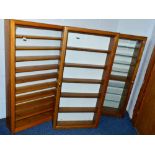 THREE GLASS FRONTED WALL MOUNTED WOODEN DISPLAY CABINETS, sizes approximately 56cm wide x 18cm