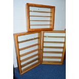 THREE GLASS FRONTED WALL MOUNTED WOODEN DISPLAY CABINETS, sizes approximately 56cm wide x 14cm