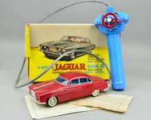 A BOXED LINCOLN INTERNATIONAL PLASTIC BATTERY OPERATED JAGUAR MARK 10 SALOON, No.7010, maroon
